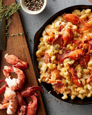 Maine lobster meat on cutting board by lobster mac and cheese